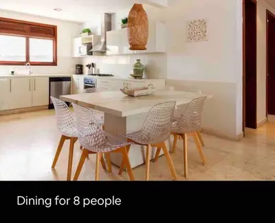 a kitchen with a white table and chairs at Charming Cartagena Apartment Your Perfect Getaway in Cartagena de Indias