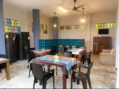 a dining room with tables and chairs and stained glass windows at Escapada Perfecta en Apartasuites Privadas Coveñas in Coveñas