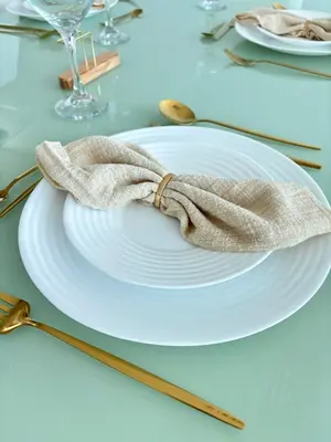 a white plate with a napkin on a table at Apartamento entero amoblado con excelente ubicación en Barranquilla in Barranquilla