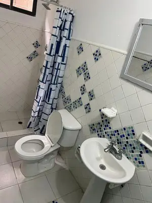 a bathroom with a toilet and a sink at Beach Airport House in Cartagena de Indias