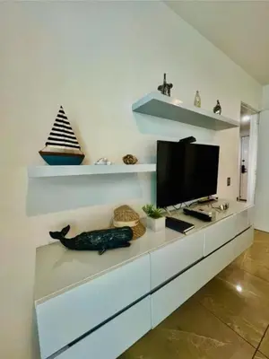 a living room with a television on a white cabinet at Luxurious, modern apartment in Cartagena Morros 3 in Cartagena de Indias