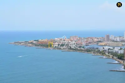 a large body of water with a city in the background at Luxurious and modern oceanfront apartment with views of the historic city 2B and 2BR in Cartagena de Indias