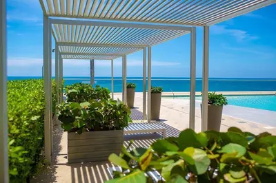 a group of potted plants sitting under a pavilion at Luxurious and modern oceanfront apartment with views of the historic city 2B and 2BR in Cartagena de Indias