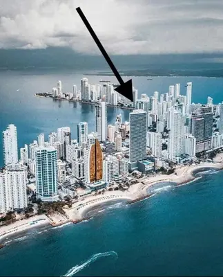 an aerial view of a city with the ocean at Luxurious and modern oceanfront apartment with views of the historic city 2B and 2BR in Cartagena de Indias