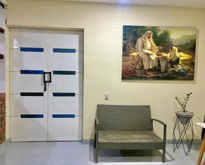 a door in a room with a painting on the wall at Casa Agarj in Santa Marta