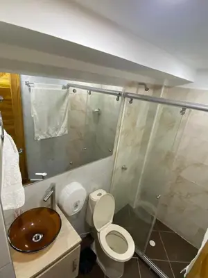 a bathroom with a sink and a toilet and a shower at Acojedor apto en coveñas in Coveñas