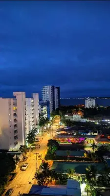 a view of a city at night with buildings at Villa Manglar in Coveñas