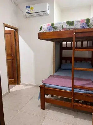 a bunk bed in a room with a door at Villa Manglar in Coveñas