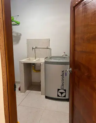 a bathroom with a sink and a trash can at Villa Manglar in Coveñas
