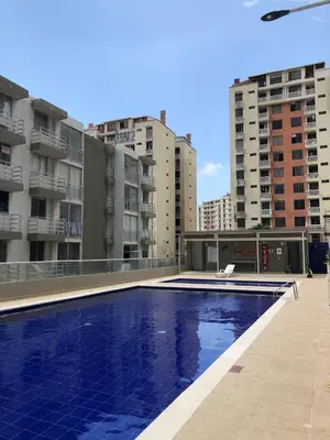 a swimming pool on the roof of a building at Comfortable 2 bedroom apartment with pool in Miramar in Barranquilla