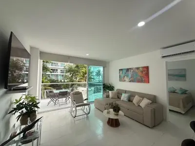 a living room with a couch and a table at ESPECTACULAR APARTAMENTO MORROS 3 Acceso directo a la Playa!!! in Cartagena de Indias
