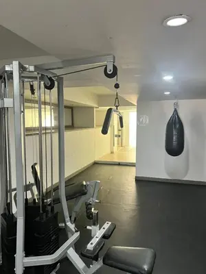 a gym with two tread machines and a punching bag at ESPECTACULAR APARTAMENTO MORROS 3 Acceso directo a la Playa!!! in Cartagena de Indias