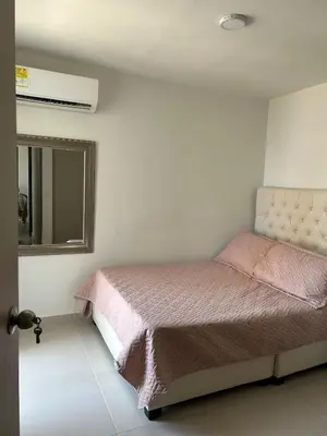 a bedroom with a bed and a mirror at Apartamento en Torices in Cartagena de Indias