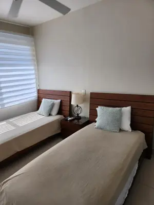 a bedroom with two beds and a window at Apartamento en Cartagena con vista al mar in Cartagena de Indias