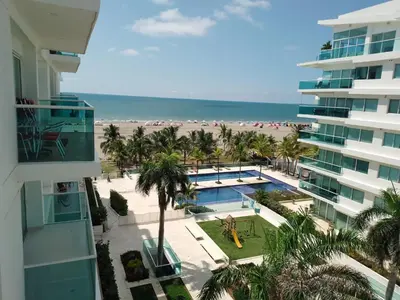a view of the beach from the balcony of a building at Apartamento vista al mar cartagena Edificio Morros in Cartagena de Indias