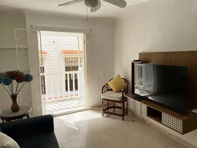 a living room with a large flat screen tv at Beautiful duplex in the historic center! in Cartagena de Indias