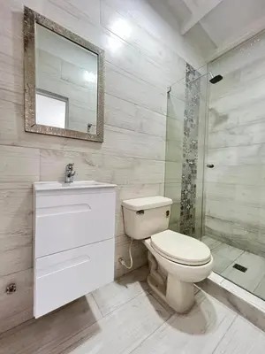 a bathroom with a toilet and a sink and a shower at Beautiful duplex in the historic center! in Cartagena de Indias