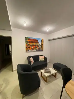 a living room with a couch and a table at Castelo - Serena Del Mar in Puerto Tierrabaja