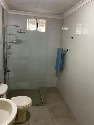 a bathroom with a shower and a toilet and a sink at Casa Estela in Cartagena de Indias