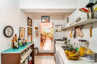 a kitchen with a counter with a sink and a counter top at Casa Vilmar Getsemani in Cartagena de Indias