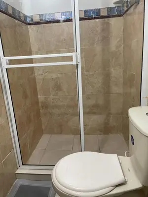 a bathroom with a shower with a toilet at Casa Vilmar Getsemani in Cartagena de Indias
