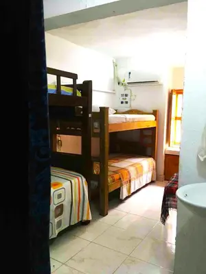 a room with two bunk beds in a room at Casa Vilmar Getsemani in Cartagena de Indias