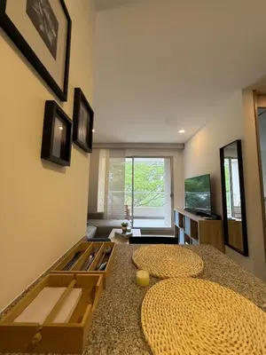 a room with two beds and a television in it at Modern Apartment in Santa Marta in Santa Marta