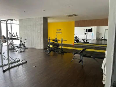 a gym with several treadmills and machines in a room at Bocagrande bay view gym jacuzzi pool in Cartagena de Indias