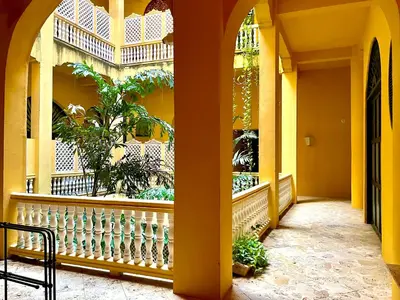 a building with a balcony with plants in it at by Calamari Homes - El Porvenir 207 walled city in Cartagena de Indias