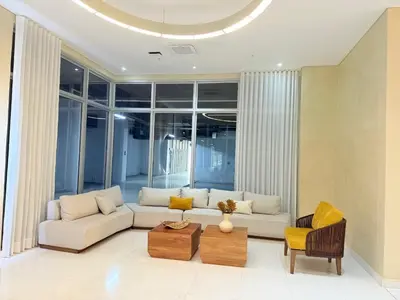 a living room with a couch and a table at Modern Apartasuit Cartagena Beach in Cartagena de Indias
