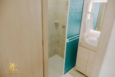 a bathroom with a shower and a sink at Modern Apartasuit Cartagena Beach in Cartagena de Indias