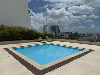 a large swimming pool on top of a building at Modern Apartasuit Cartagena Beach in Cartagena de Indias