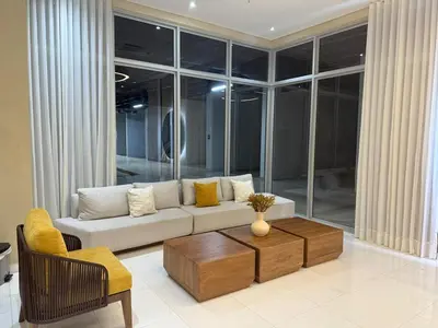 a living room with a couch and a coffee table at Luxurious Apartasuit CartagenaBeach1139 in Cartagena de Indias
