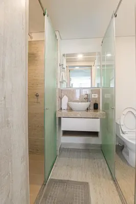 a bathroom with a sink and a toilet at Luxurious Apartasuit CartagenaBeach1139 in Cartagena de Indias