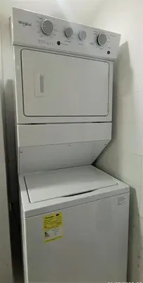 a white stove sitting on top of a refrigerator at Exclusivo apartamento de lujo frente al mar en Los Morros, con acceso directo y privado a la mejor playa de Cartagena in Cartagena de Indias