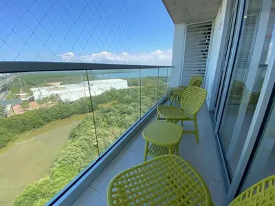 a balcony with chairs and a view of the ocean at Premium Hub 1304 APARTAMENTO CARTAGENA Vista al Mar in Cartagena de Indias