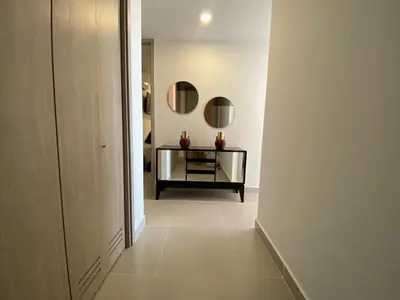 a hallway with a table and mirrors in a room at Premium Hub 1304 APARTAMENTO CARTAGENA Vista al Mar in Cartagena de Indias