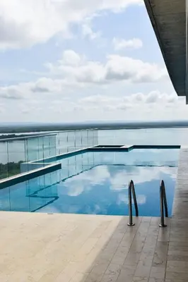 a swimming pool with a view of the ocean at Premium Hub 1304 APARTAMENTO CARTAGENA Vista al Mar in Cartagena de Indias