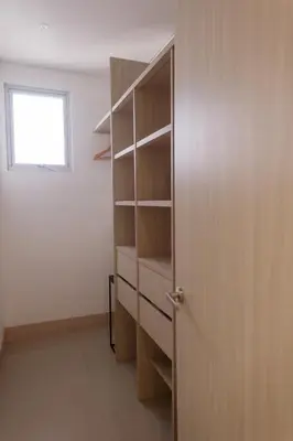 a closet with a wooden door and a window at Murano Elite by MOME in Cartagena de Indias