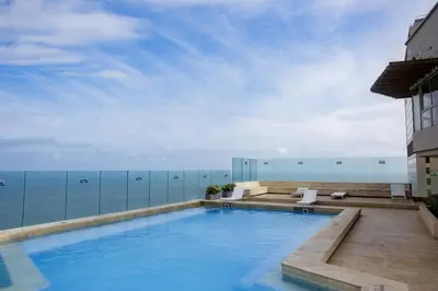 a swimming pool on the roof of a building at Murano Elite by MOME in Cartagena de Indias