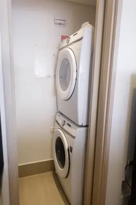 a washing machine and a washer in a bathroom at Murano Elite by MOME in Cartagena de Indias