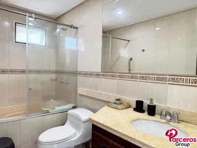 a bathroom with a toilet and a sink at Apartamentos Torres Del Lago Por Parceros Group in Cartagena de Indias
