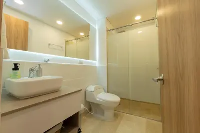 a bathroom with a toilet and a sink and a shower at Seaside Serenity and Style in Cartagena de Indias