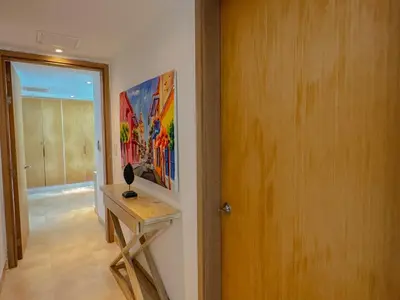 a room with a table and a painting on the wall at Hotel Radisson Residences Ocean Pavillion in Cartagena de Indias