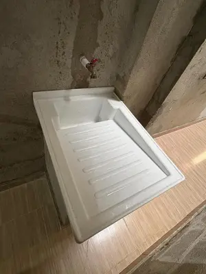 a white sink in the corner of a room at Maru apartamentos in Cartagena de Indias
