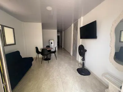 a living room with a couch and a table at Maru apartamentos in Cartagena de Indias
