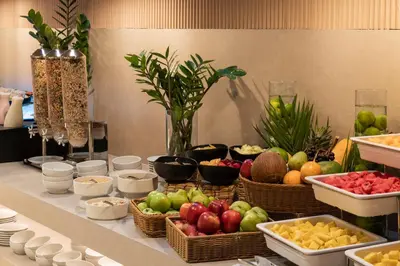 a buffet of fruits and vegetables in baskets on a table at OZ Hotel Collection in Cartagena de Indias