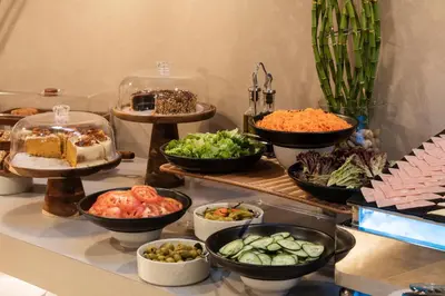 a buffet with bowls of different types of food at OZ Hotel Collection in Cartagena de Indias
