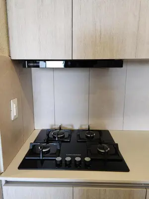 a stove top oven sitting in a kitchen at Dominique 609 Apartment with private jacuzzi in Cartagena de Indias