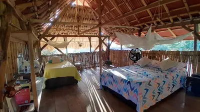 a bedroom with a bed in a tent at Casa Surya - Cabaña sostenible en la naturaleza in San Onofre